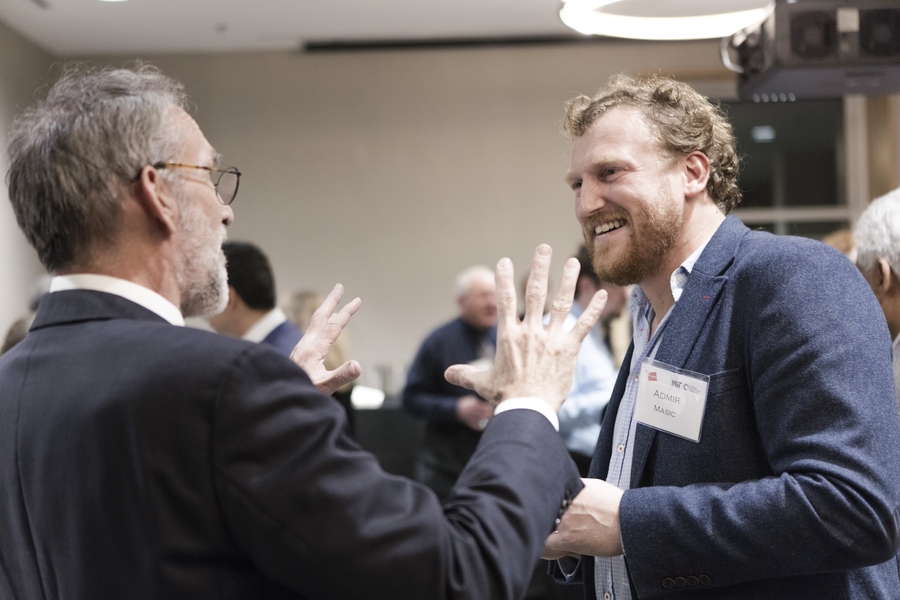 CEE Assistant Professor Admir Masic chats with an alumnus during the CEE New Research Reception networking hour on Oct. 26.