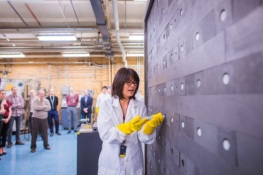 Senior Research Scientist Lin-wen Hu loads a fuel rod into one channel of MIT’s graphite exponential pile. 