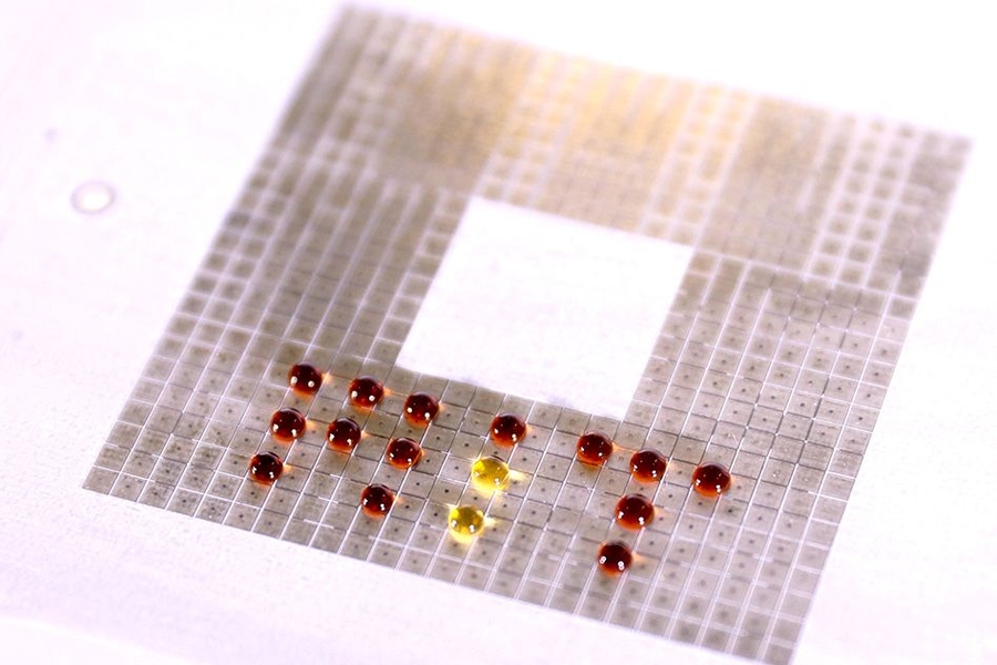 MIT researchers have developed hardware that uses electric fields to move droplets of chemical or biological solutions around a surface, mixing them in ways that could be used to test thousands of reactions in parallel.
