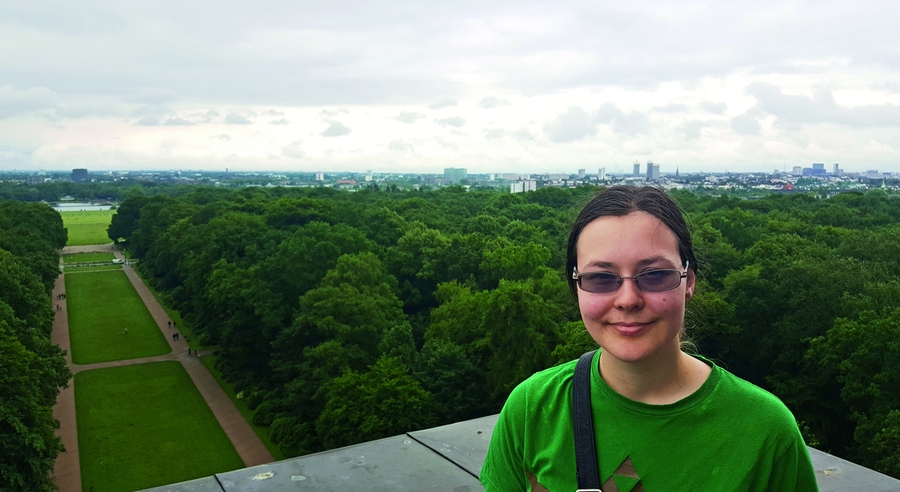 Carissa Skye, a third-year physics major who interned at Shell in Hamburg, Germany, poses at the top of the Hamburg Planetarium.