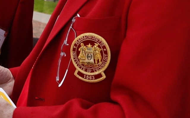 MIT seal on an alumni red jacket