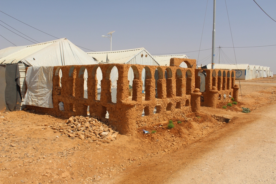 An adobe version of the Palmyra Arch in the Al Azraq refugee camp in Jordan.