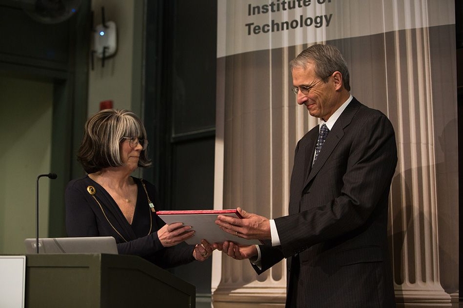 Richard Schrock receives the James R. Killian Jr. Faculty Achievement Award from Susan Silbey, the chair of MIT’s faculty.
