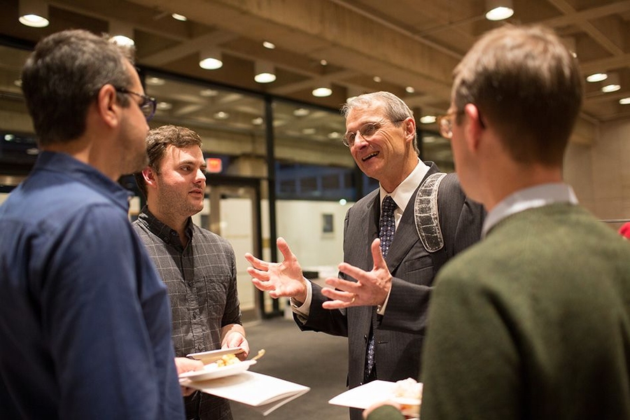 Richard Schrock chats with audience members at a post-lecture reception.
