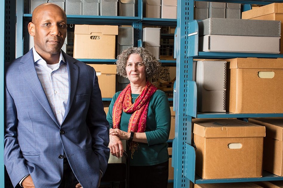 Craig Steven Wilder and Nora Murphy, photographed in the Institute Archives and Special Collections Reading Room in Building 14N. 
