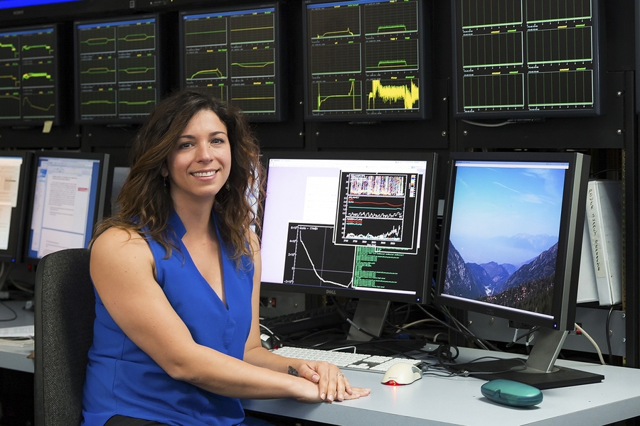 MIT postdoc Cristina Rea records data about disruptions in fusion plasmas from the DIII-D control room.