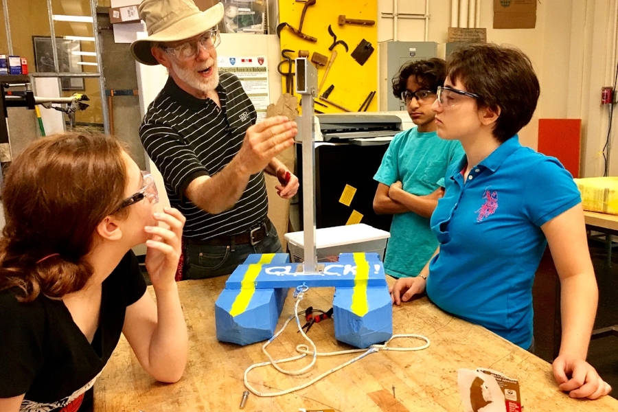 Instructor Ed Moriarty consults with members of Team QUICK, who built a submersible sensor platform that could be used for environmental monitoring in the Charles River and other bodies of water. Pictured are (l-r) Ava Hosea, Ed Moriarty, Monowheel team member Kartik Pingle, and Irene Mitsiades.