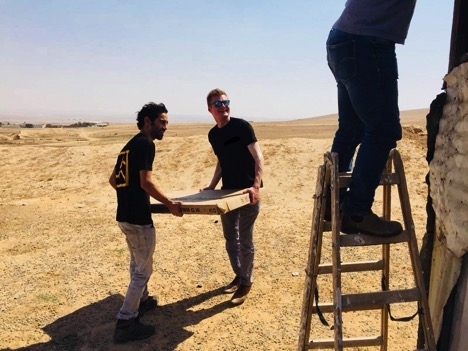 MISTI student, Lukas Kamphausen, installing solar panels for low income families in the Middle East