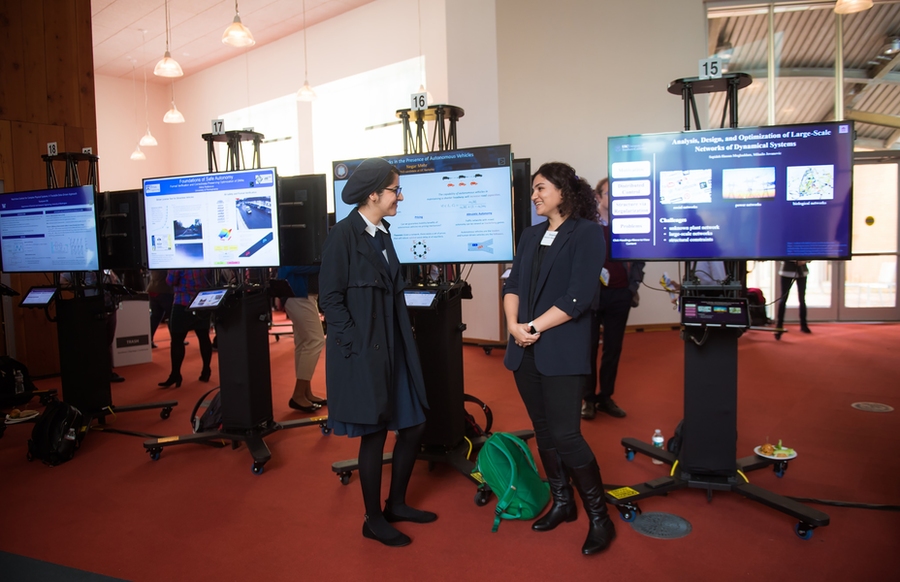 Workshop attendees presented their research with MIT faculty and each other during the Rising Stars poster session. 