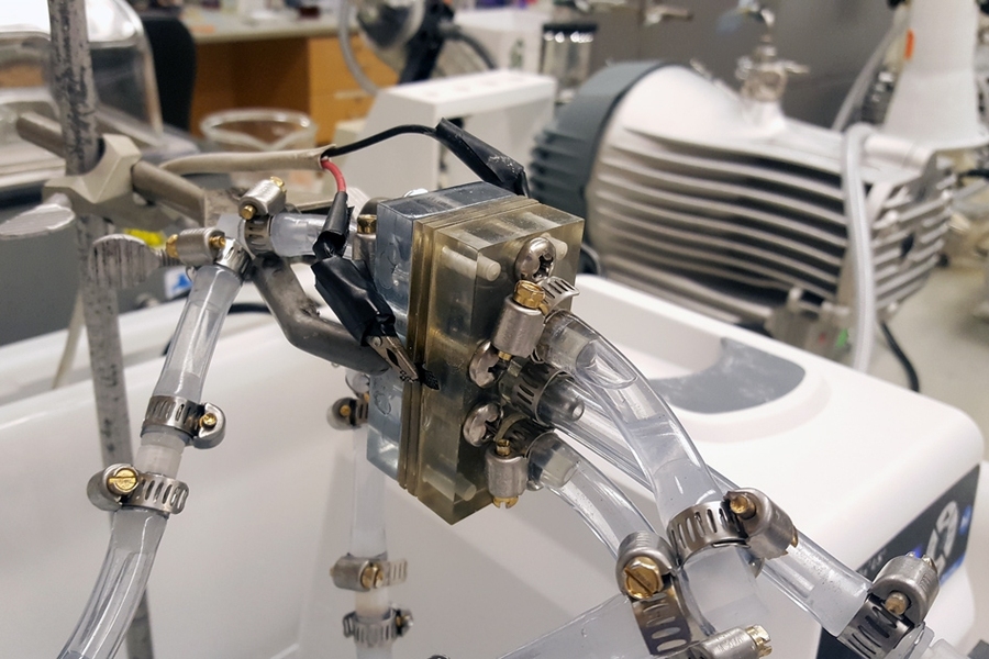 Photo shows the proof-of-concept battery built by the research team to demonstrate how their system could work in practice. The battery lasted through 24 days of use and standby cycles, compared to just three days for a comparable battery without the new protective system in place.