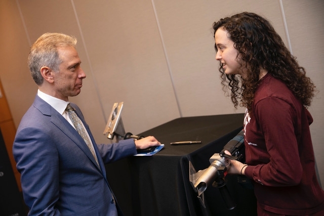 Elizabeth Bianchini ’18 shows a prototype of Rhino to Andrei Iancu, the director of the U.S. Patent and Trademark Office, at an expo during the Collegiate Inventors Competition.