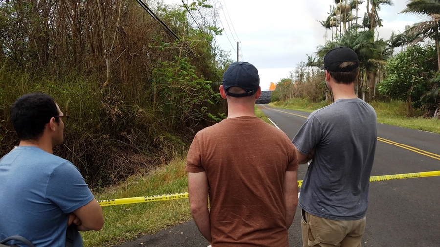 Graduate student David Hagan, Professor Jesse Kroll, and postdoc Ben Crawford observe Kilauea’s eruption from inside Leilani Estates in Hawaii in May. 