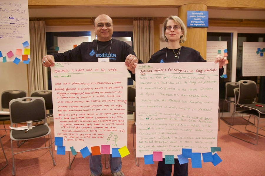Maria Kalampaliki (right) and Amol Matharu display their vision statements. 