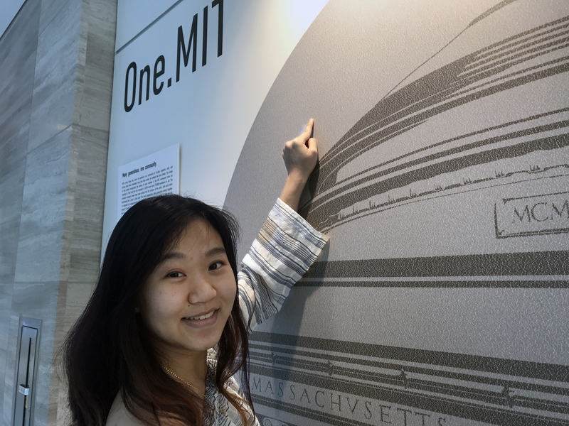 Jocelyn Yao, a second-year student majoring in biological engineering, points to the location of her name on the enlargement of “One.MIT” in the MIT.nano gallery.