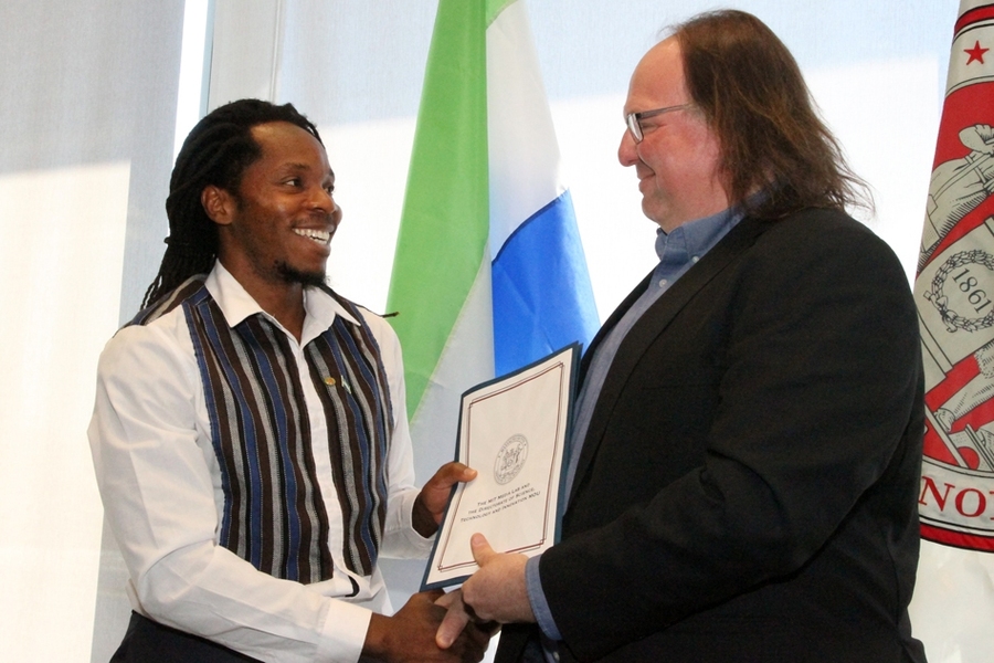 Ethan Zuckerman, head of the MIT Media Lab’s Center for Civic Media, and David Sengeh, PhD ’16, Sierra Leone’s Chief Innovation Officer, exchange a memorandum of understanding for collaborative work.