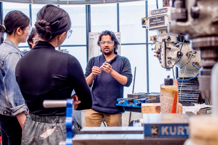MIT Chemistry graduate student Atharva Sahasrabudhe explains work in his lab to participants in the Summer 2019 MIT and FIT AFFOA Workshop in Advanced Functional Fabrics. 