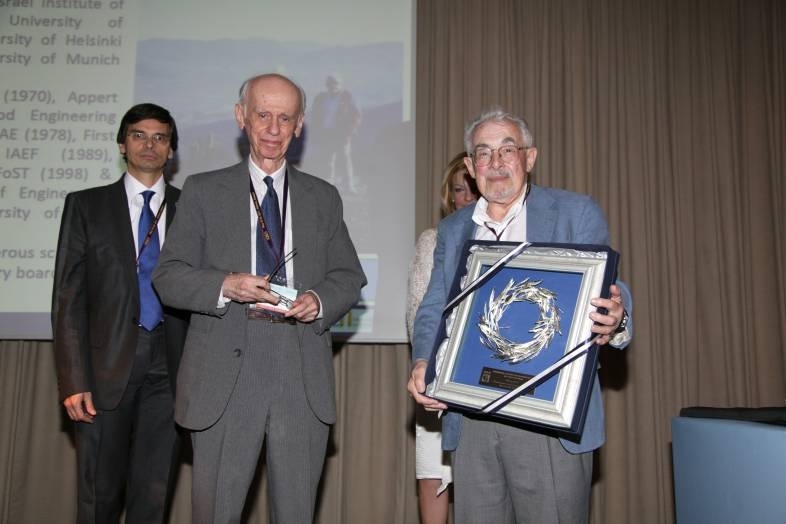 At the 2011 International Conference for Engineering and Food, Marc Karel (right) receives the ICEF 11 Lifetime Achievement award, recognizing his lifelong contribution and international impact on the progress of food engineering.