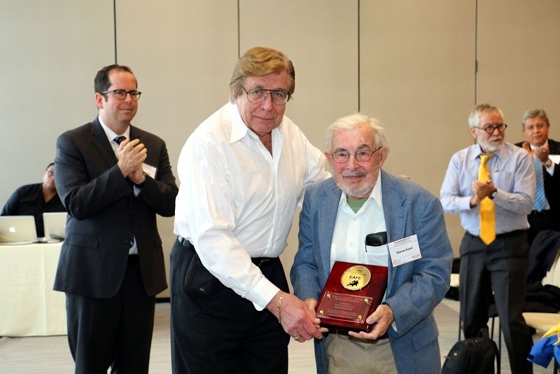 During a symposium in his honor on May 16, 2016, Professor Emeritus Marc Karel (center right) receives a plaque from the European Academy of Food Engineering, sponsored by the Institute of Food Technology.