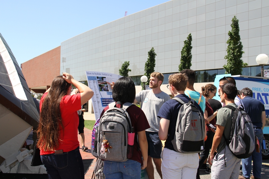 Andrew Bouma, co-president of the MIT Water Club, educates students about local tap water. 
