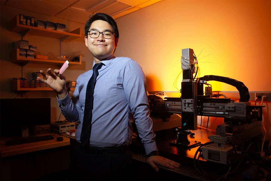 MIT graduate student Hyunwoo Yuk displays the double-sided tissue adhesive.