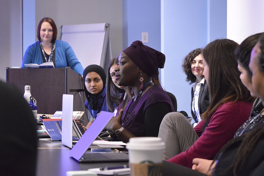 Professor of civil and environmental engineering and workshop chair Colette Heald (standing) listens to discussion during workshop session.