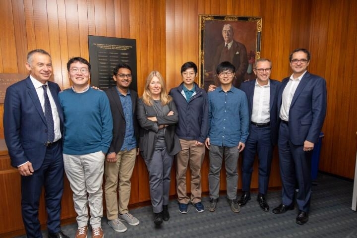 MIT Professor Mircea Dincă (far right) and his team pose with Lamborghini CEO Stefano Domenicali (far left), CTO Maurizio Reggiani (second from right), and MIT-Italy's Serenella Sferza (fourth from left) to celebrate the filing of an MIT-Lamborghini joint patent.