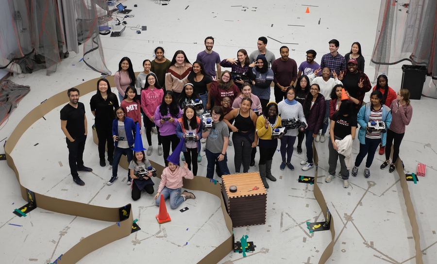 Middle school and high school girls meet in MIT's Building 31 to showcase the capabilities of the autonomous cars their teams programmed to navigate a circuitous course. 