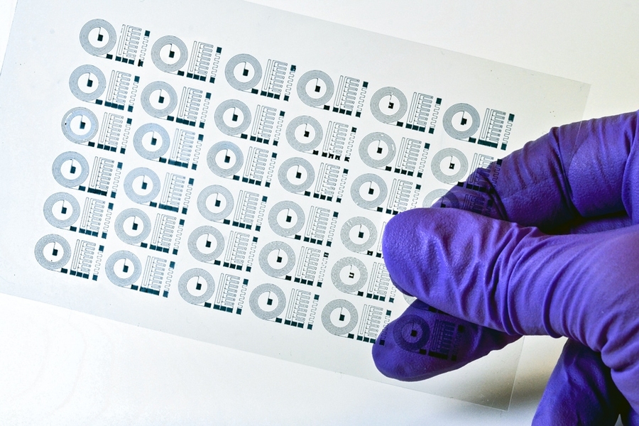 MIT researchers have 3-D-printed soft electronically active polymers into a number of devices, including a pliable neural electrode, and (shown here) a flexible circuit.