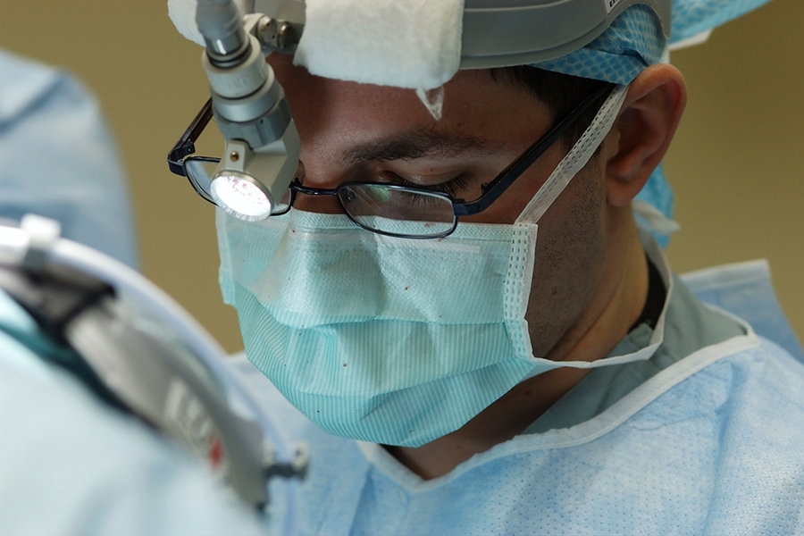 "The production of PPE, for example masks, is much more complicated than people might appreciate, and 3D printed masks may do more harm than good," says Professor Martin Culpepper. Seen here, a surgeon wears a protective mask.