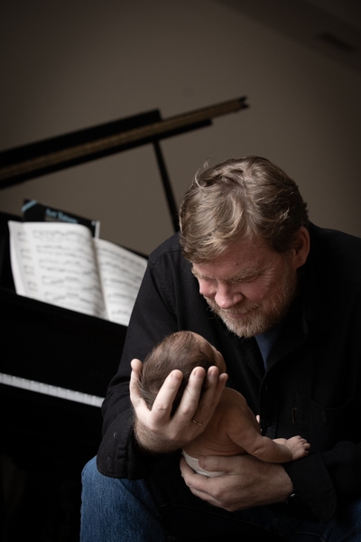 Michael Hawley holds newborn son Tycho Hawley in 2018.