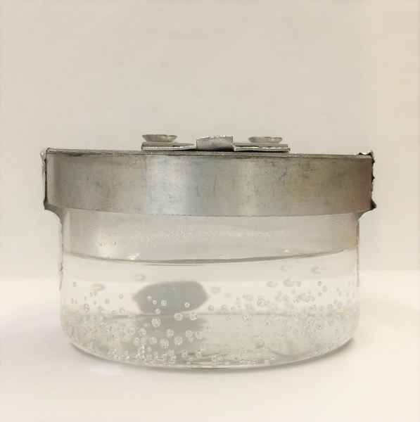 This beaker with a lid was used by the research team to get data about the surface tension of seawater.