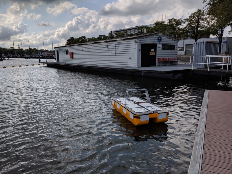 A wide-angle photo of the MIT autonomous boat Roboat II