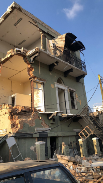 Picture of wreckage of a cream-colored building
