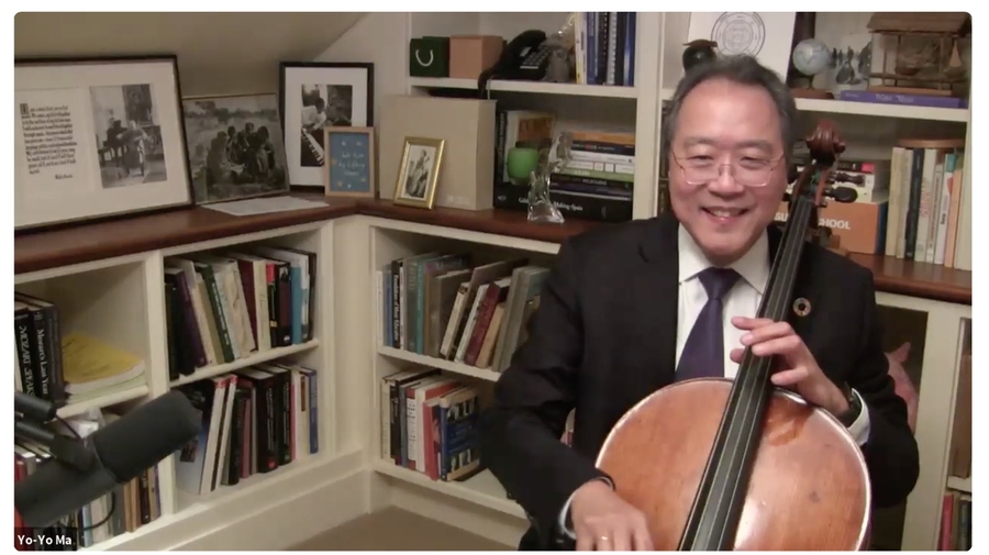 Screen capture of Yo-Yo Ma playing his cello in front of a bookcase