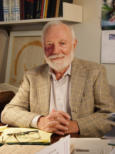 Photo of Isadore Singer sitting in his office