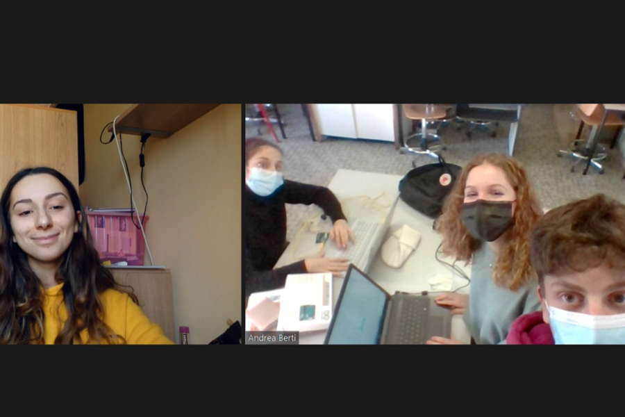 Video screengrab showing two windows: one featuring a single student, smiling; the other featuring three students, wearing facemasks, in a lab 