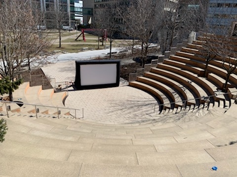 Empty Stata Amphitheater with a movie screen in the center