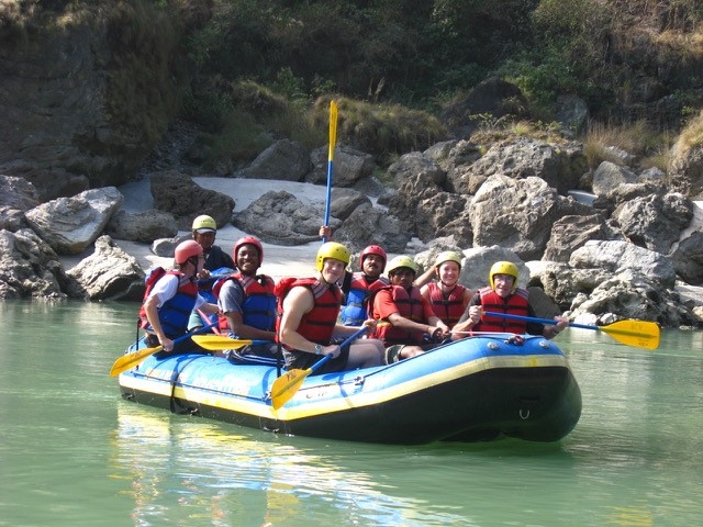 Photo of rafters in an inflatable boat on a river
