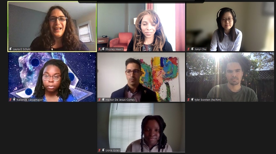 Screenshot of seven people speaking by video conferencing, arranged in three rows of 3, 3 and 1.