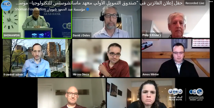 Screenshot of eight people in a Zoom session with Arabic writing overlaid