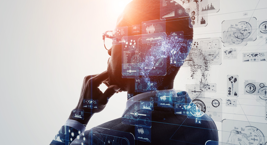 Photo illustration of a man facing away from the camera, with his hand on his chin, while various computer screens floating around the back of his head