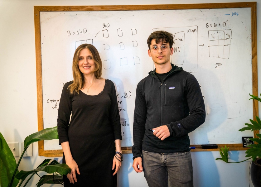 Photo of Regina Barzilay and Adam Yala standing side-by-side before a whiteboard