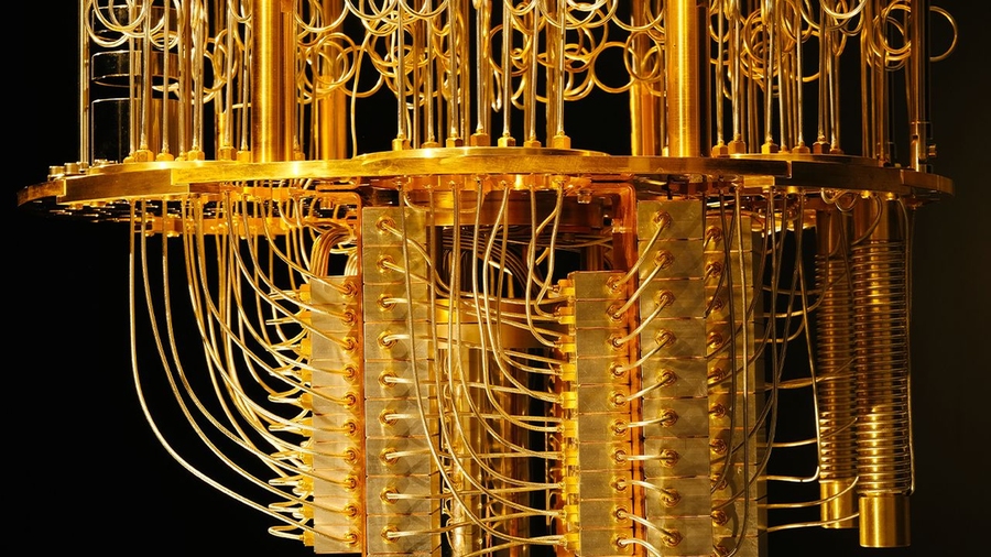 Close-up photo of IBM’s quantum computer, an elaborate maze of golden wires and components