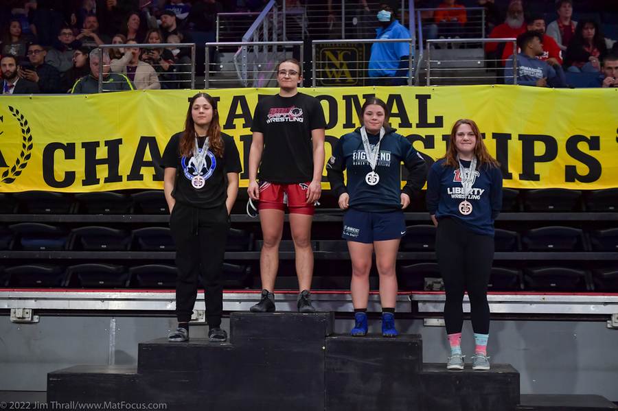 Photo of National champion Sarah Sams atop the winners' podium at the NCWA National Championships.