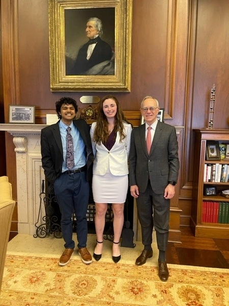 Bhav Jain and Liberty Ladd pose for a photo with MIT President L. Rafael Reif.