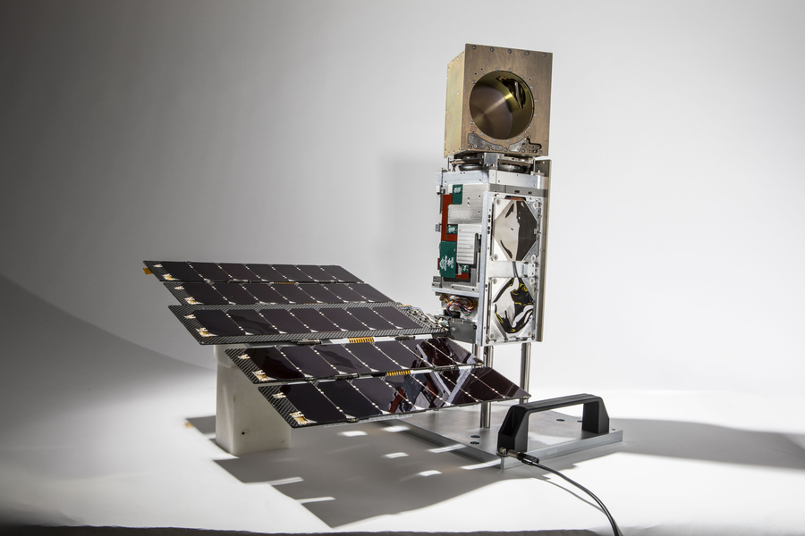 The TROPICS small satellite is shown with its solar panel unfurled. The satellite is about the size of a half-gallon of milk.