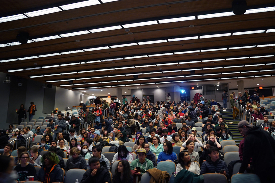 Students fill seats of a lecture hall auditorium