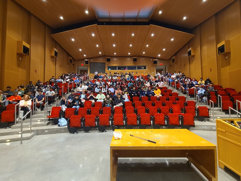 A photo taken from the stage in Kresge Auditorium, looking out to the audience that mostly made up of high school students.