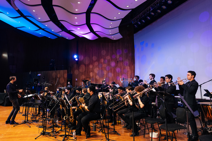 A large jazz ensemble plays on stage at MIT's Kresge Auditorium