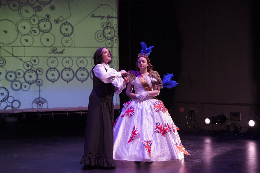 Aliana de la Guardia as Ada Lovelace and Erin Matthews as Queen Victoria perform on a stage